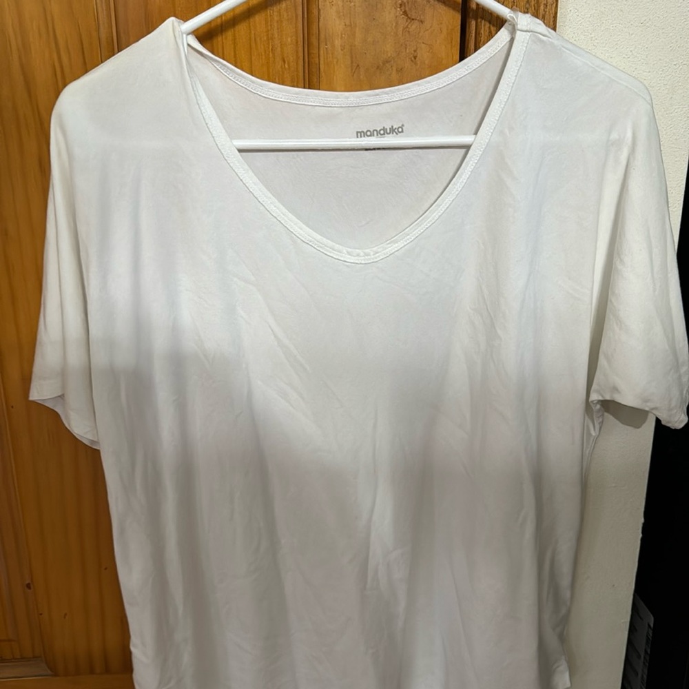 Manduka white shirt for women in very good condition size small.
